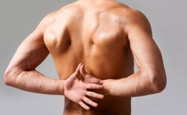 A man has back pain in the area under the shoulder blades. 