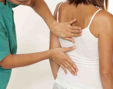 A patient complaining of pain in the shoulder blades on both sides at a doctor's appointment